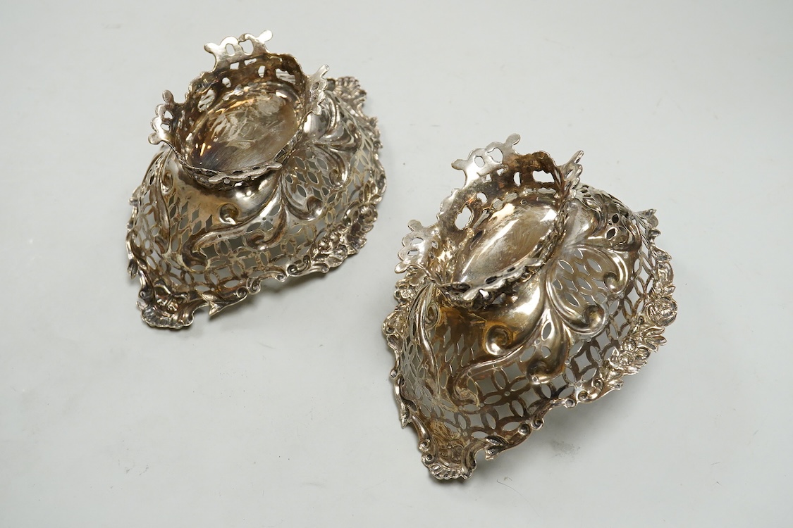 A pair of late Victorian pierced silver boat shaped bonbon dishes, with engraved monogram, by Charles Boyton II, London, 1897, length 16.4cm, 7.3oz.